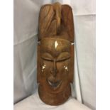 A CARVED WOODEN TRIBAL SENEGALESE 'THE HUNTER' MASK H:48CM