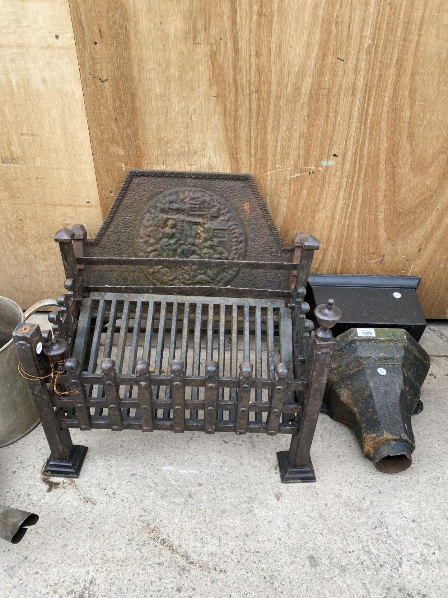 TWO VINTAGE CAST IRON GUTTER HOPPERS AND A CAST IRON FIRE GRATE