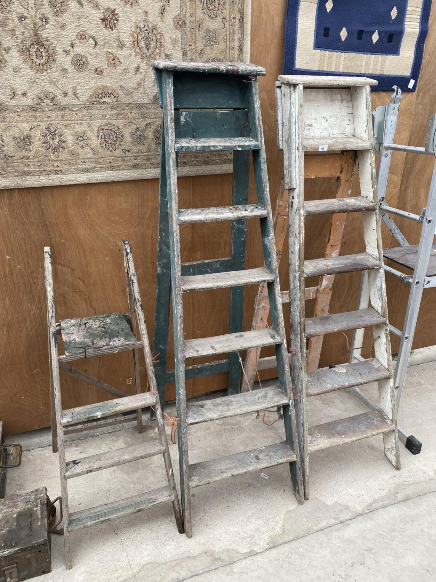 TWO SETS OF VINTAGE SIX RUNG WOODEN STEP LADDERS AND A FURTHER THREE RUNG WOODEN STEP LADDER