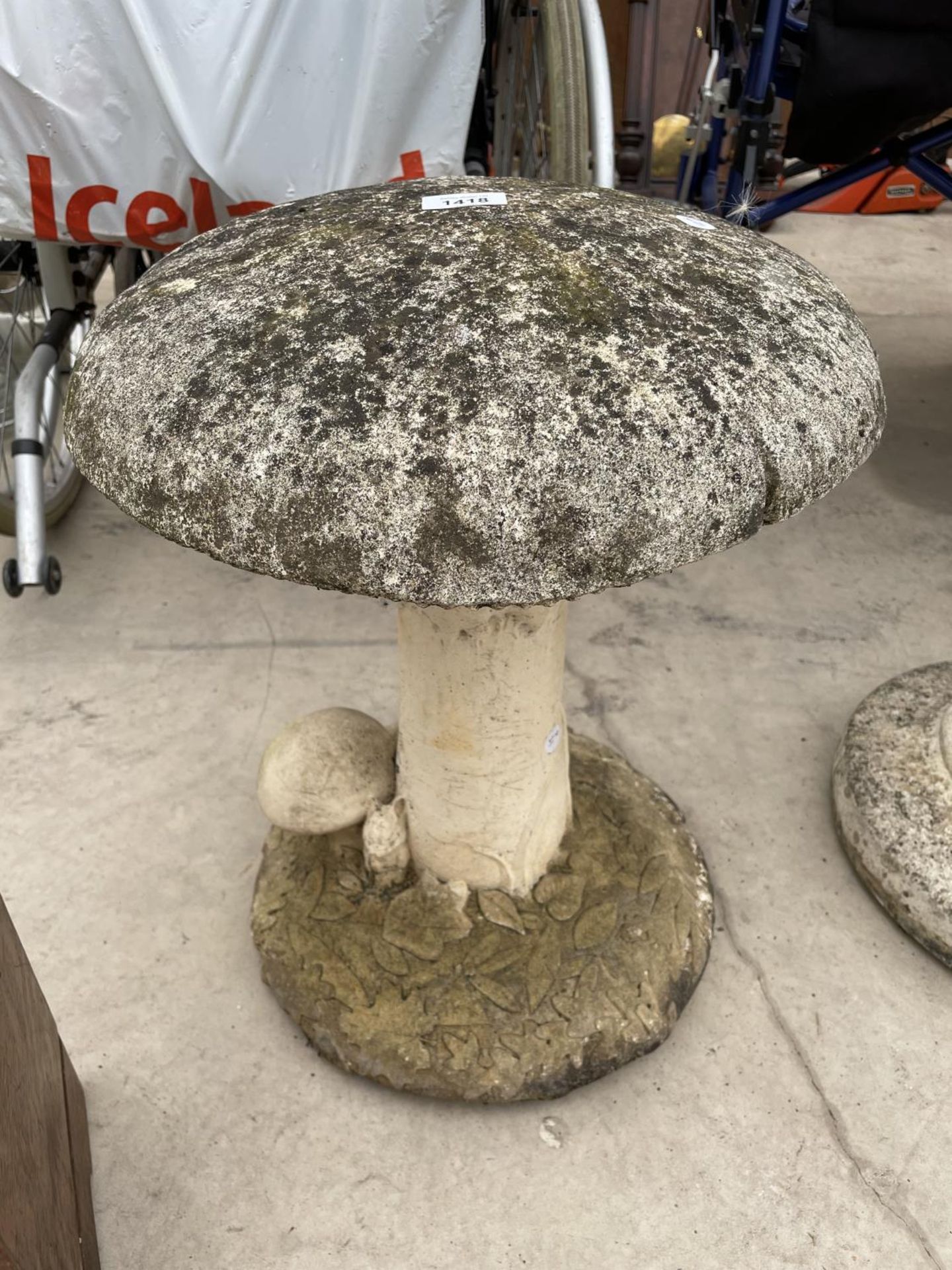 A STONE EFFECT GARDEN MUSHROOM ORNAMENT