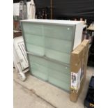 A FLAT SURFACE RADIATOR IN NEW CONDITION AND TWO WALL UNITS WITH GLASS SLIDING DOORS