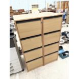 A PAIR OF FOUR DRAWER WOODEN FILING CABINETS