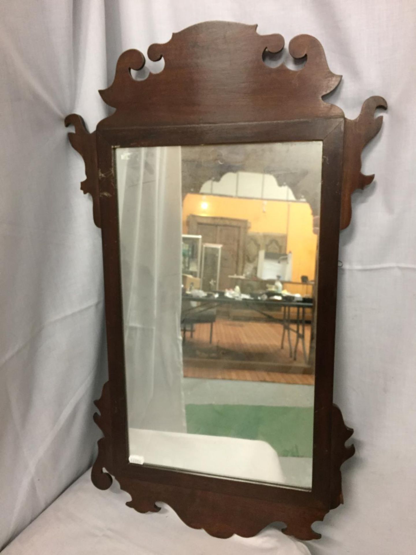 AN ORNATE GEORGIAN MAHOGANY FRAMED WALL MIRROR A/F