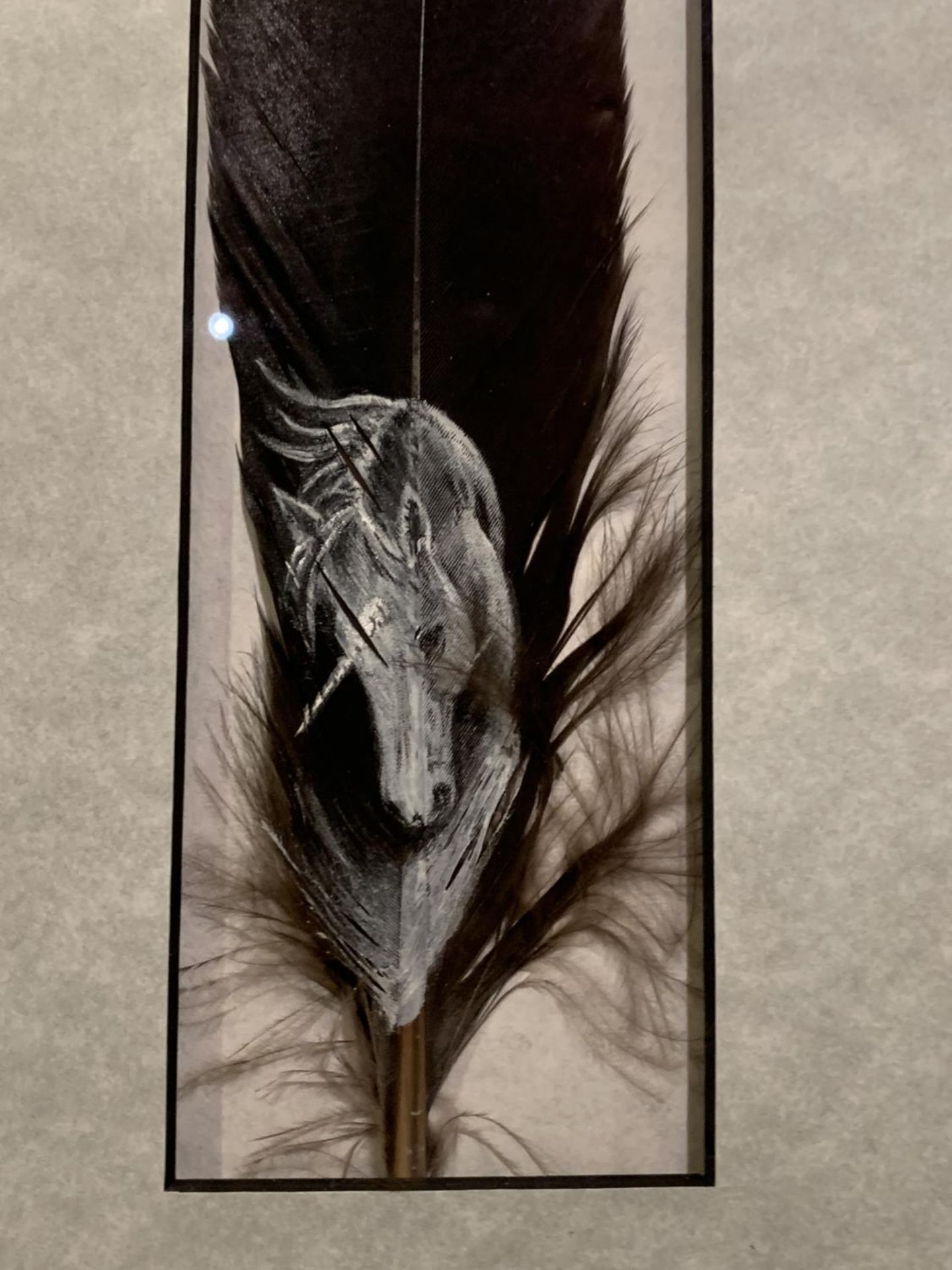 A FRAMED FEATHER DELICATELY PAINTED WITH A UNICORN HEAD - Image 2 of 2