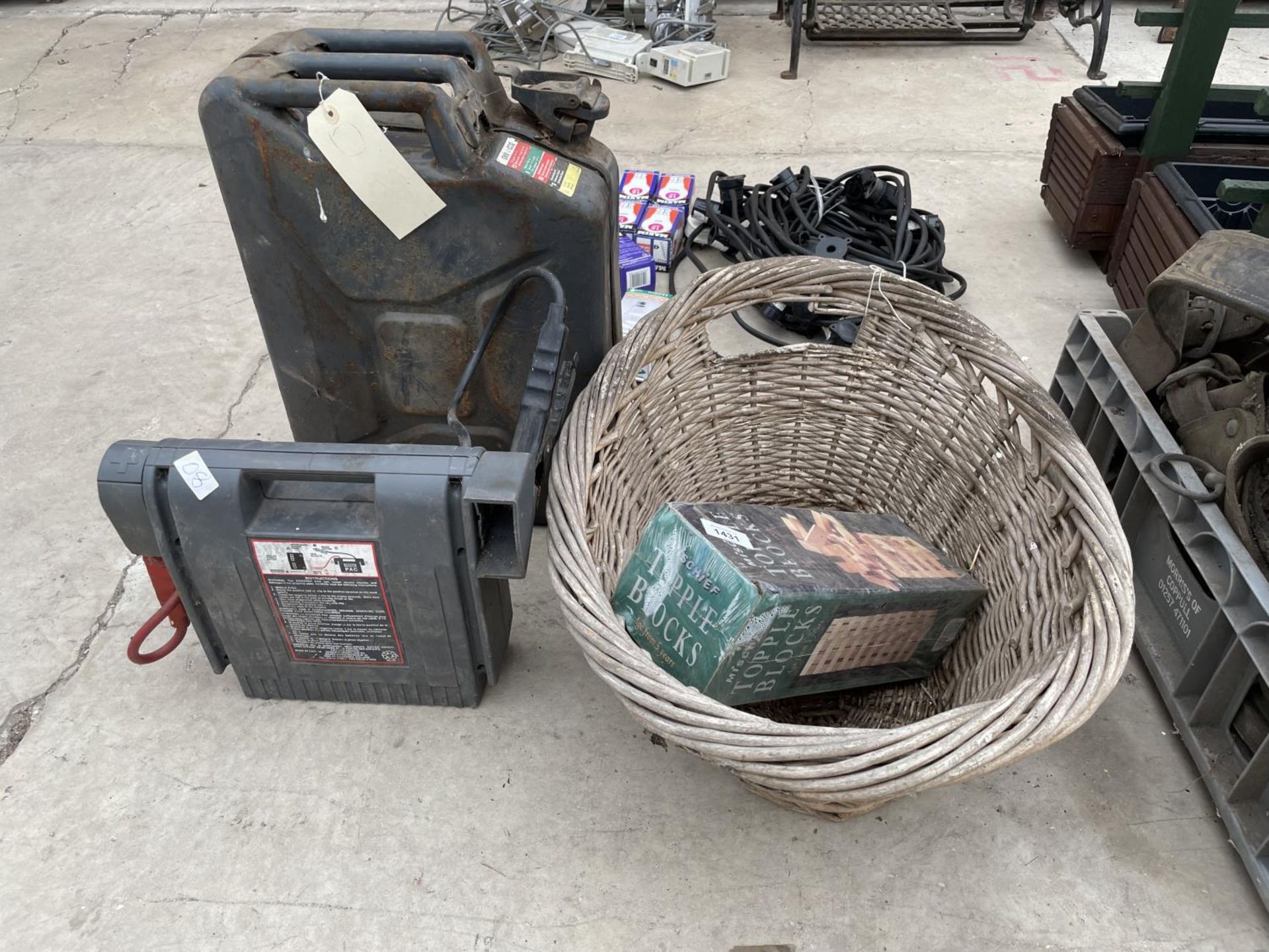 AN ASSORTMENT OF ITEMS TO INCLUDE A WICKER LOG BASKET, A JERRY CAN AND A BATTERY CHARGER ETC