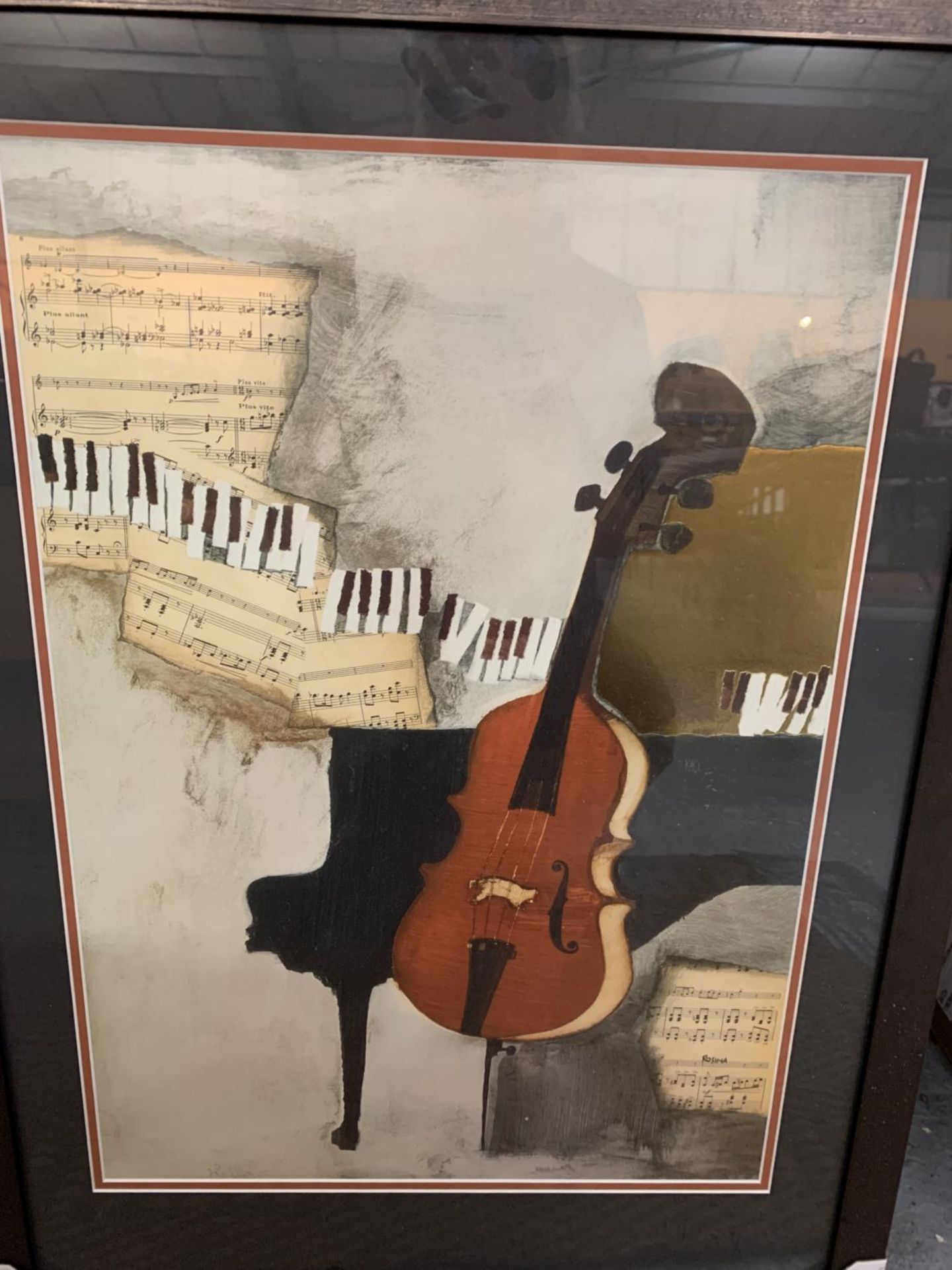 A BLACK FRAMED PRINT OF A VIOLIN AND PIANO