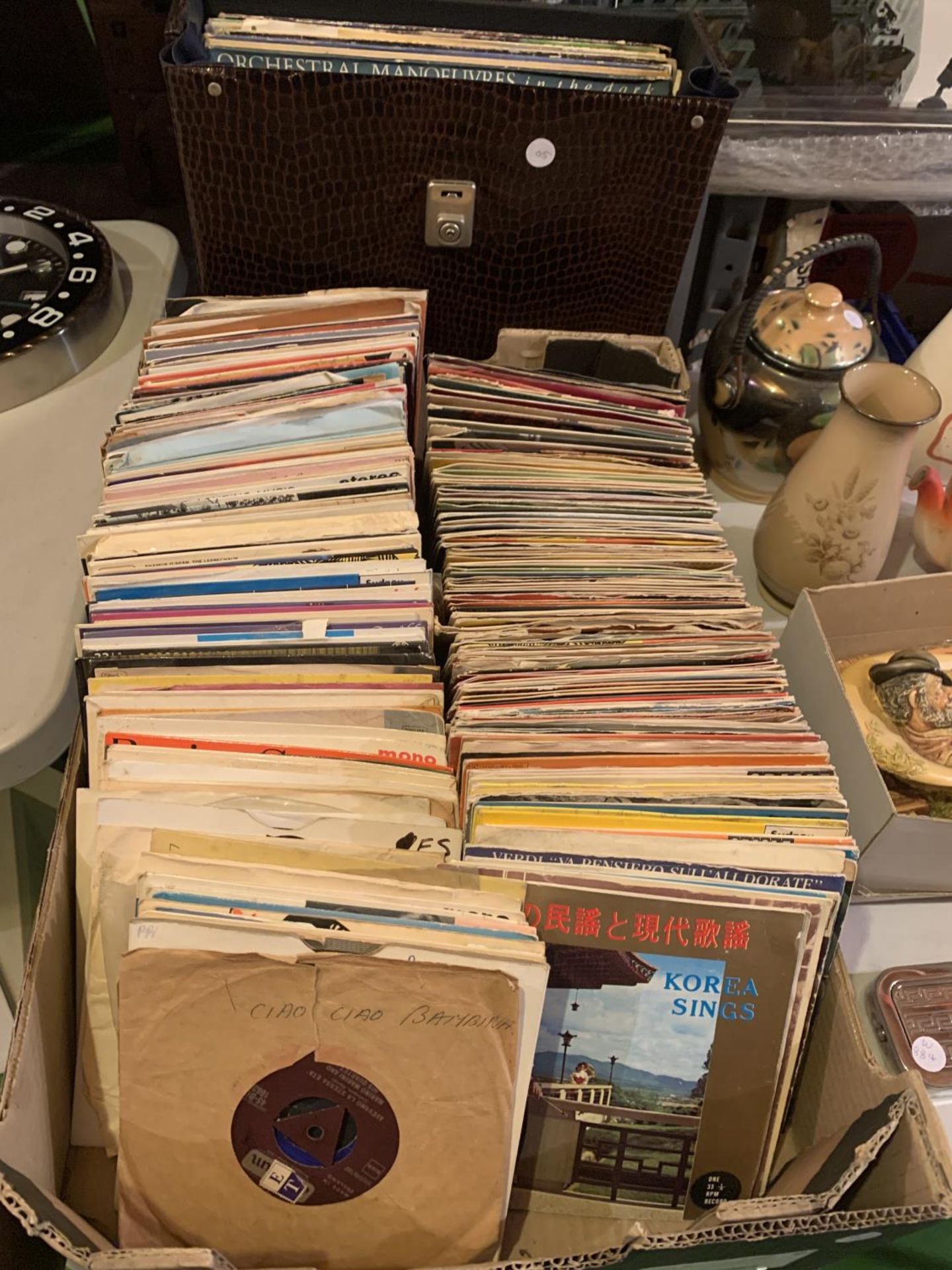 A LARGE BOX OF SINGLE RECORDS AND A CASE WITH LPS