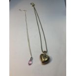 TWO SILVER NECKLACES (ONE SILVER GILT) WITH PENDANTS TO INCLUDE A PINK DROP CRYSTAL AND A HEART