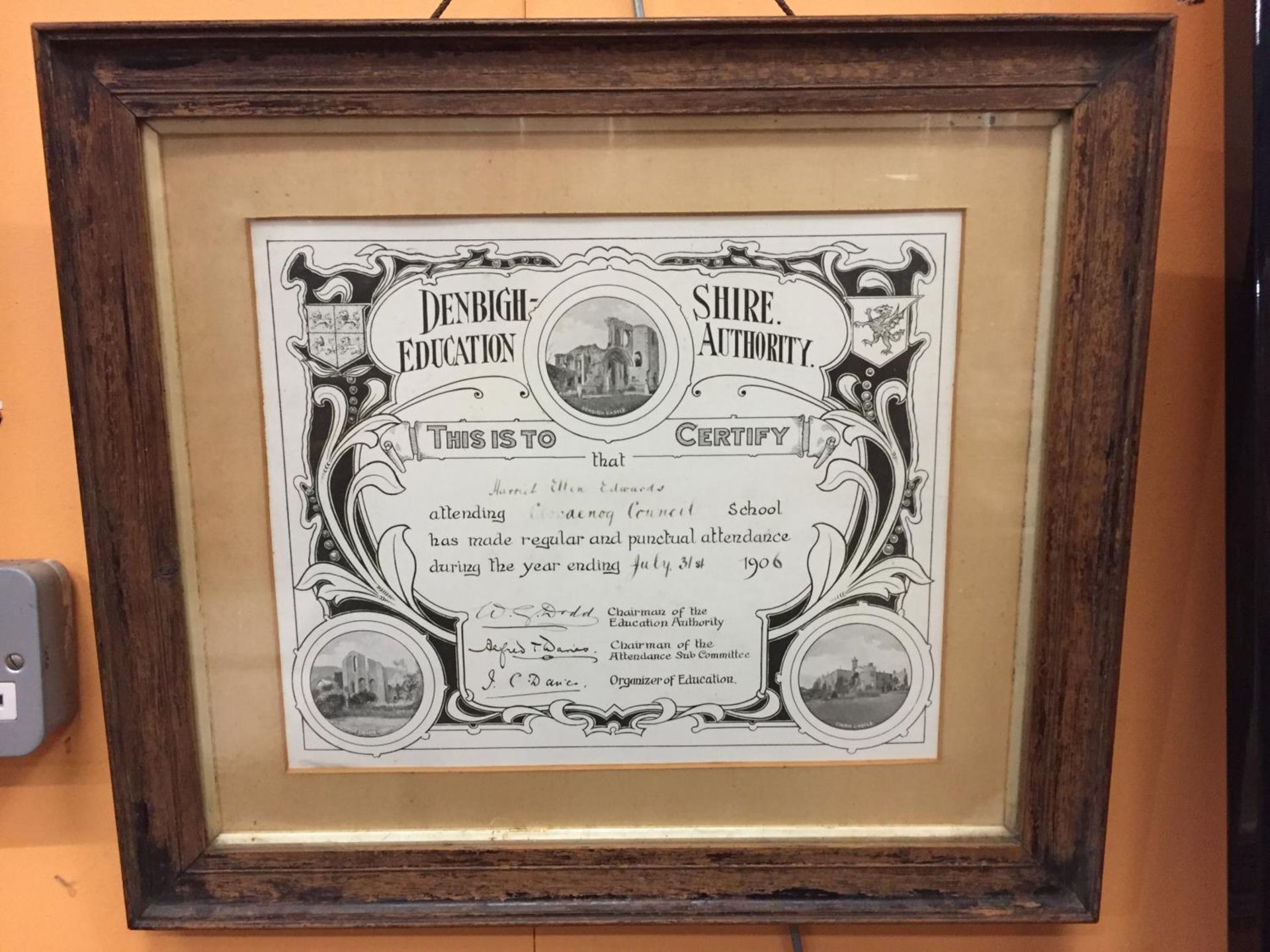 A FRAMED 1906 DENBIGHSHIRE EDUCATION AUTHORITY CERTIFICATE OF ATTENDANCE