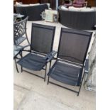 A PAIR OF METAL FRAMED FOLDING GARDEN CHAIRS AND A SIDE TABLE