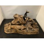 A HAND CARVED AND PAINTED 'WOLF ON THE HUNT' WOODEN SCULPTURE