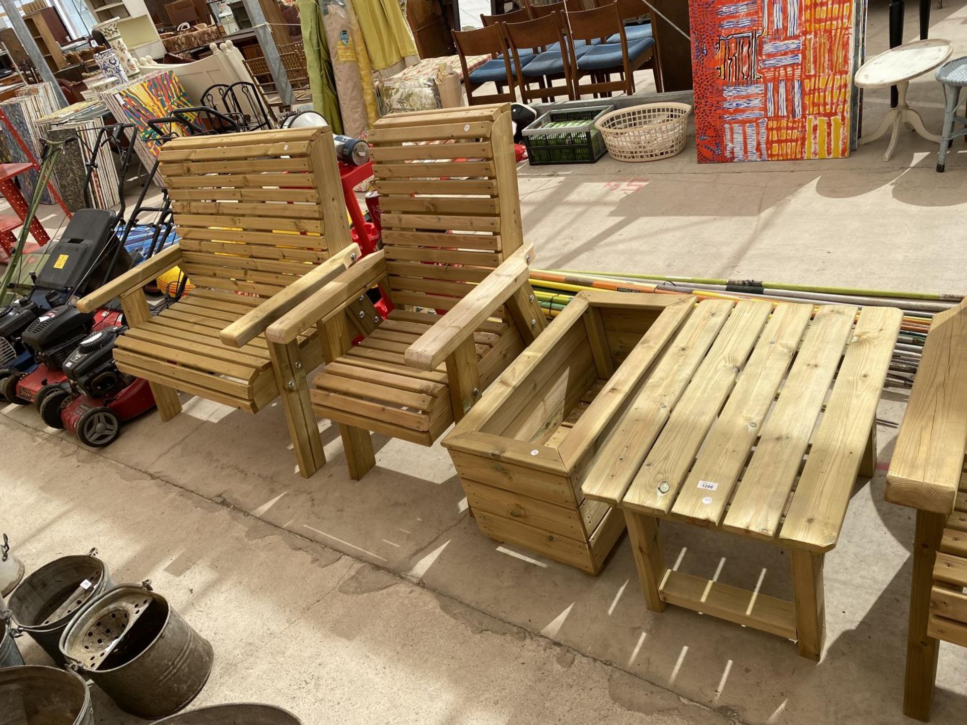 A WOODEN GARDEN FURNITURE SET TO INCLUDE A TWO SEATER BENCH, A CHAIR, A PLANTER AND A SIDE TABLE