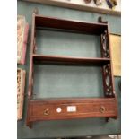 A MAHOGANY WALL HANGING DISPLAY SHELF WITH LOWER DRAW