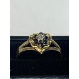 A 9 CARAT GOLD HEART SHAPED RING WITH DIAMOND AND SAPPHIRES