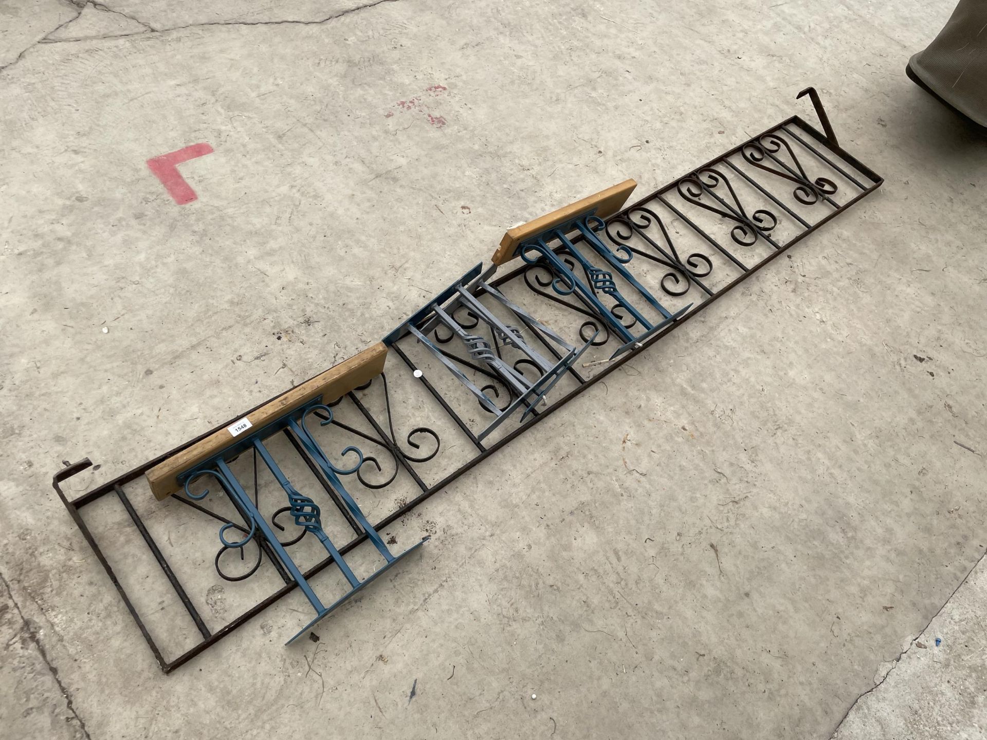 AN ASSORTMENT OF DECORATIVE AND TURNED WROUGHT IRON RAILING PANELS