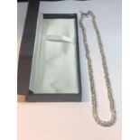 A SILVER NECKLACE 18 INCHES WITH A PRESENTATION BOX