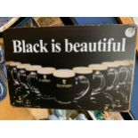 A 'BLACK IS BEAUTIFUL' GUINESS SIGN 30CM X 20CM