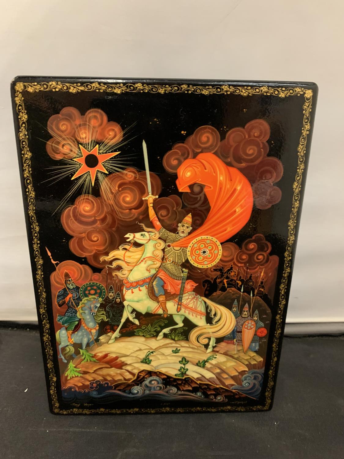 A RUSSIAN HANDPAINTED LACQUER BOX 'PRINCE IVOR' SIGNED ALONG THE BOTTOM EDGE 1980'S 15CM X 21CM