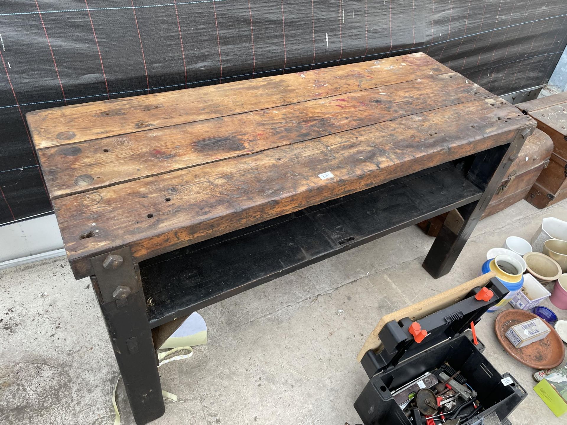 A VINTAGE HEAVY DUTY WORK BENCH WITH LOWER SHELF