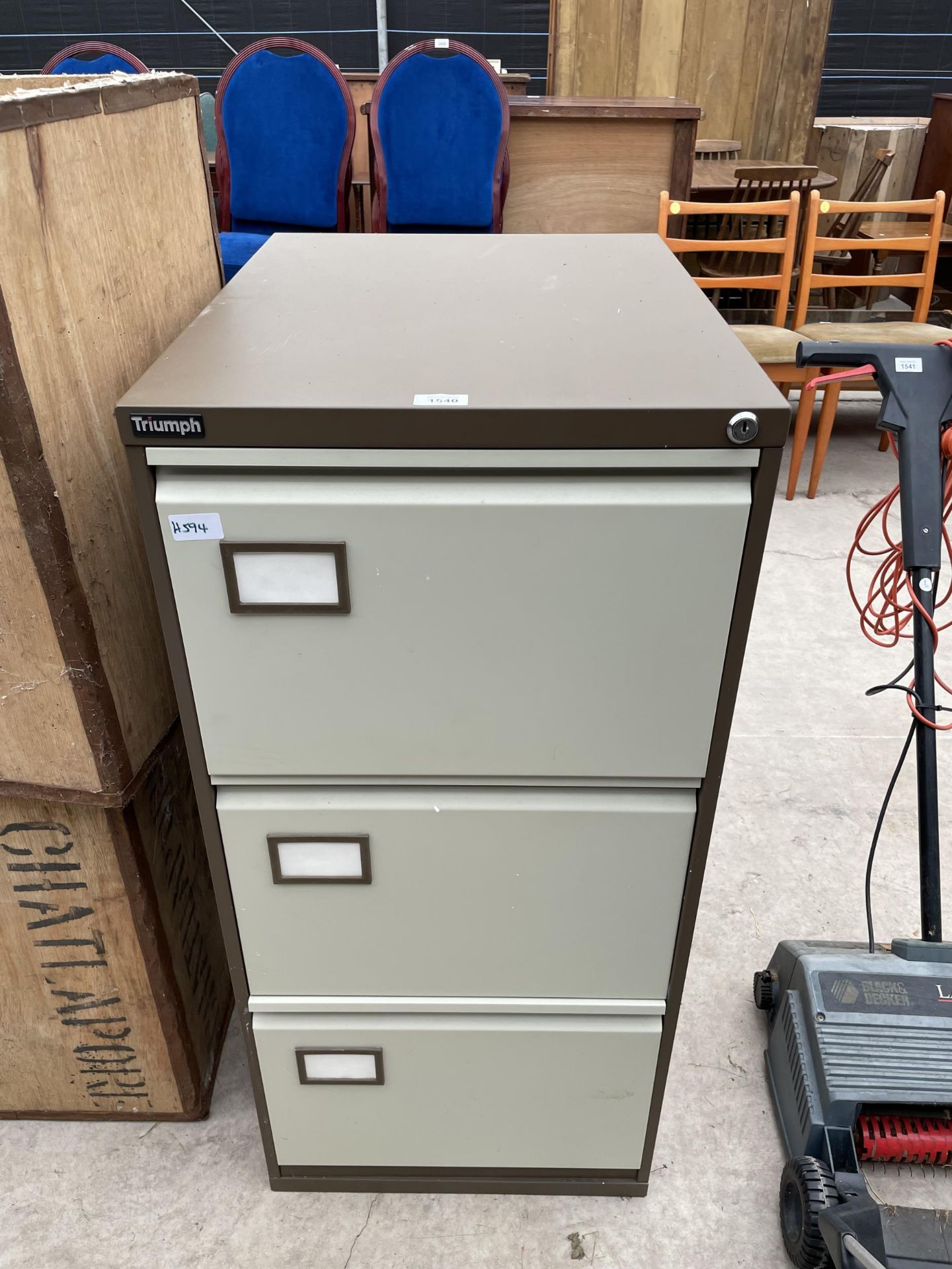 A THREE DRAWER METAL FILING CABINET