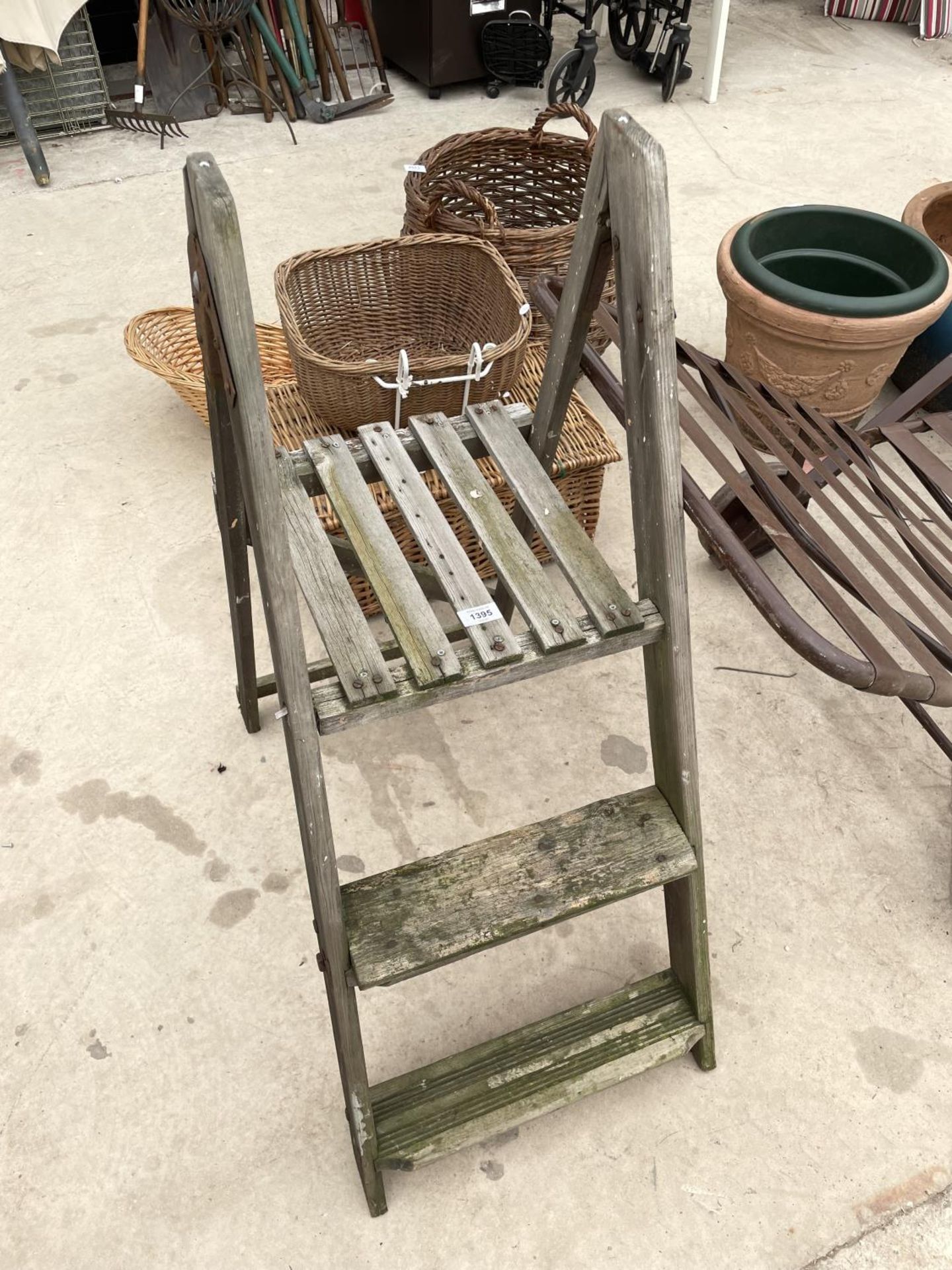 A VINTAGE WOODEN TWO RUNG STEP LADDER