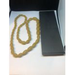 AN AMBER BUTTERSCOTCH NECKLACE WITH A PRESENTATION BOX