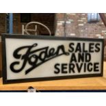 A 'FODEN SALES AND SERVICE' ILLUMINATED SIGN
