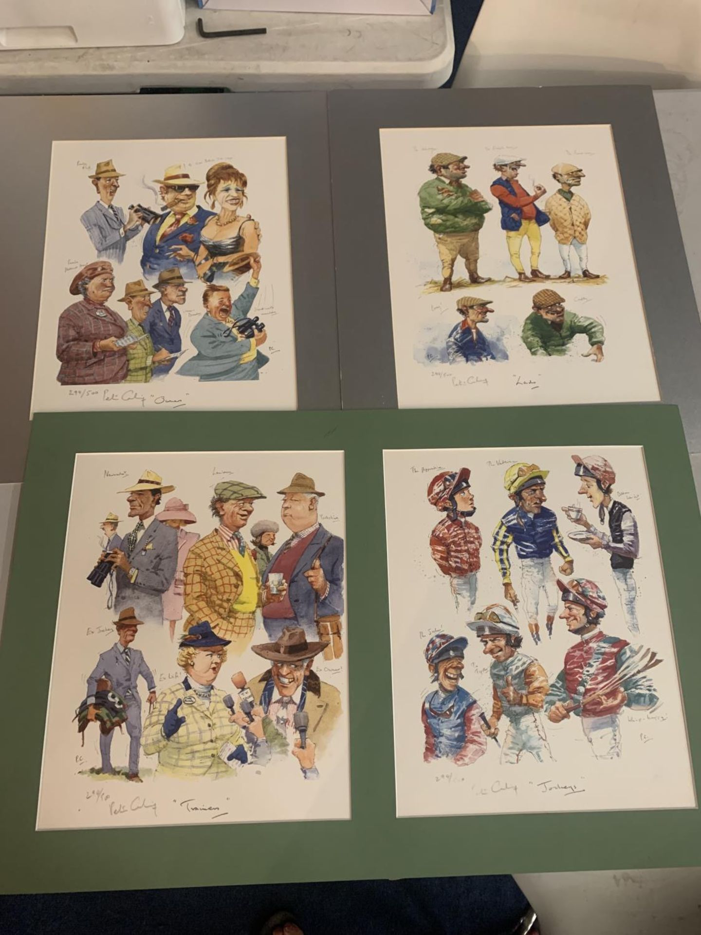 FOUR CARICATURES STYLE PRINTS IN MOUNTS- JOCKEYS, OWNERS, TRAINERS AND LADS LIMITED EDITION 294/