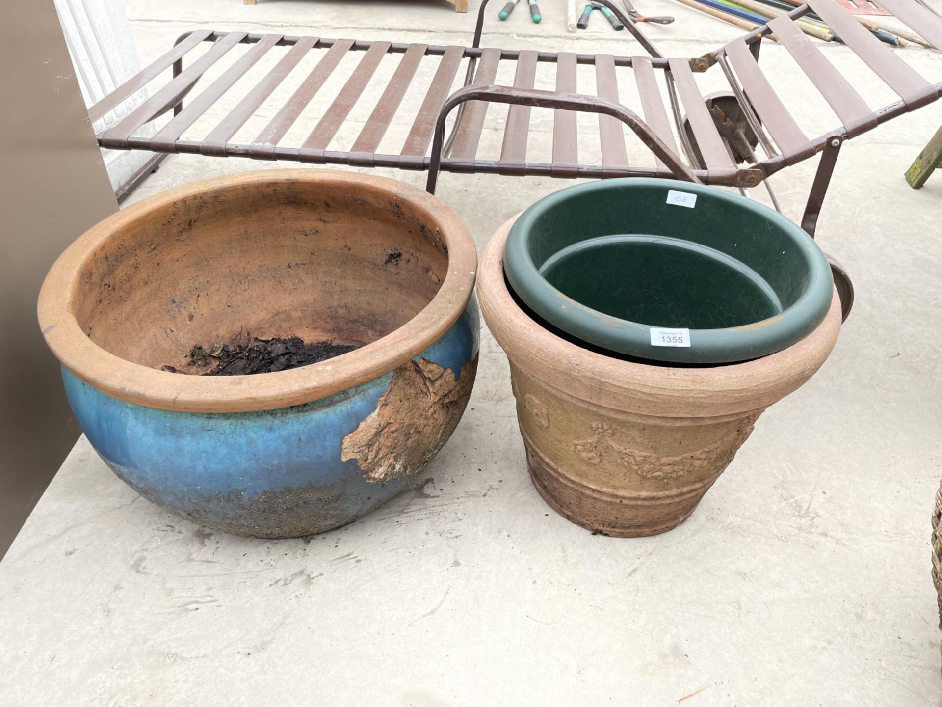 A LARGE CERAMIC PLANTER AND TWO FURTHER PLASTIC PLANT POTS