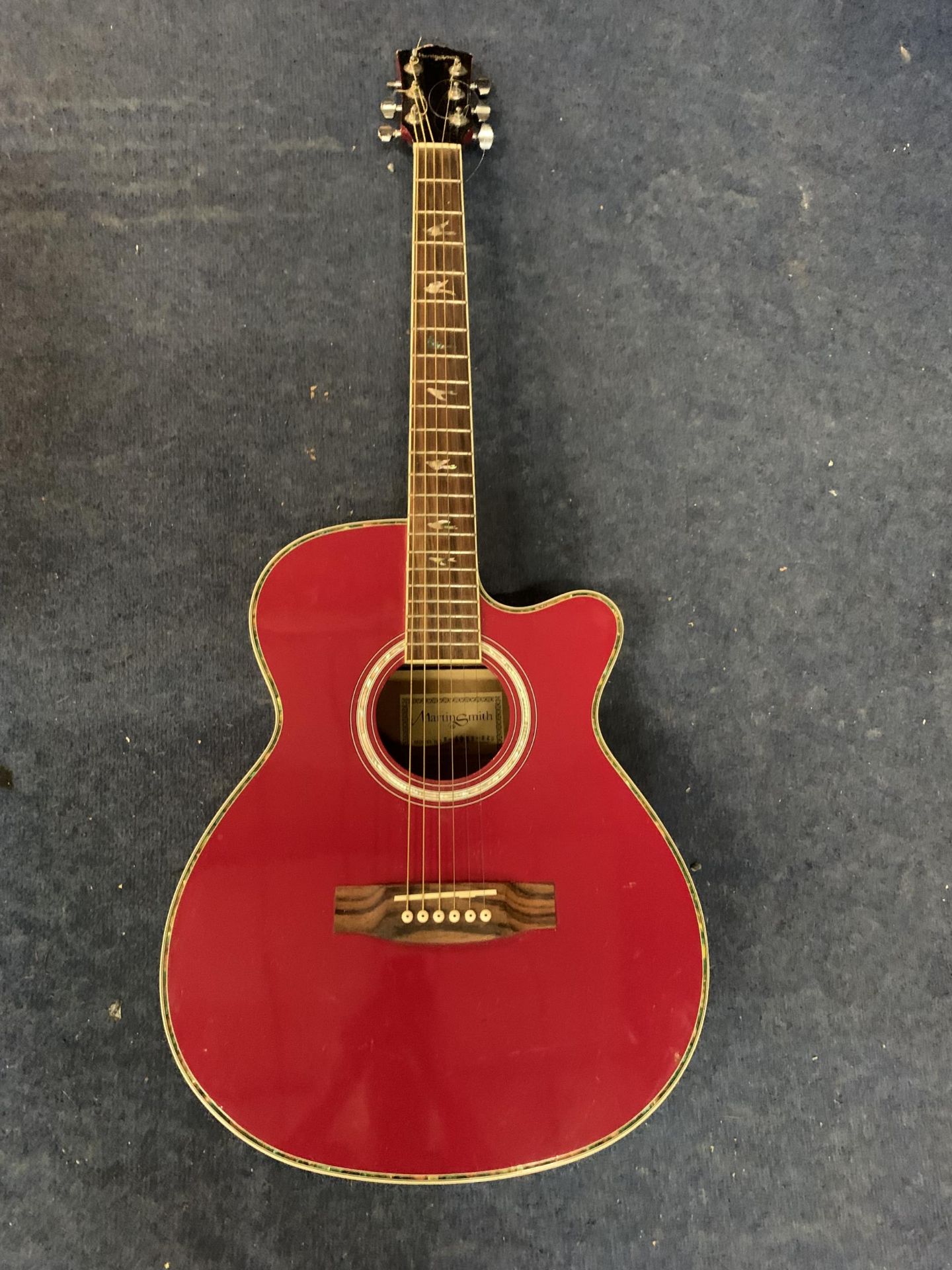 A MARTIN SMITH ACOUSTIC GUITAR MODEL NO. 401E- RED