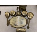 AN EIGHT PIECE ORNATE GILT DRESSING TABLE SET COMPRISING TRAY, HAND HELD MIRROR, BRUSHES, TRINKET