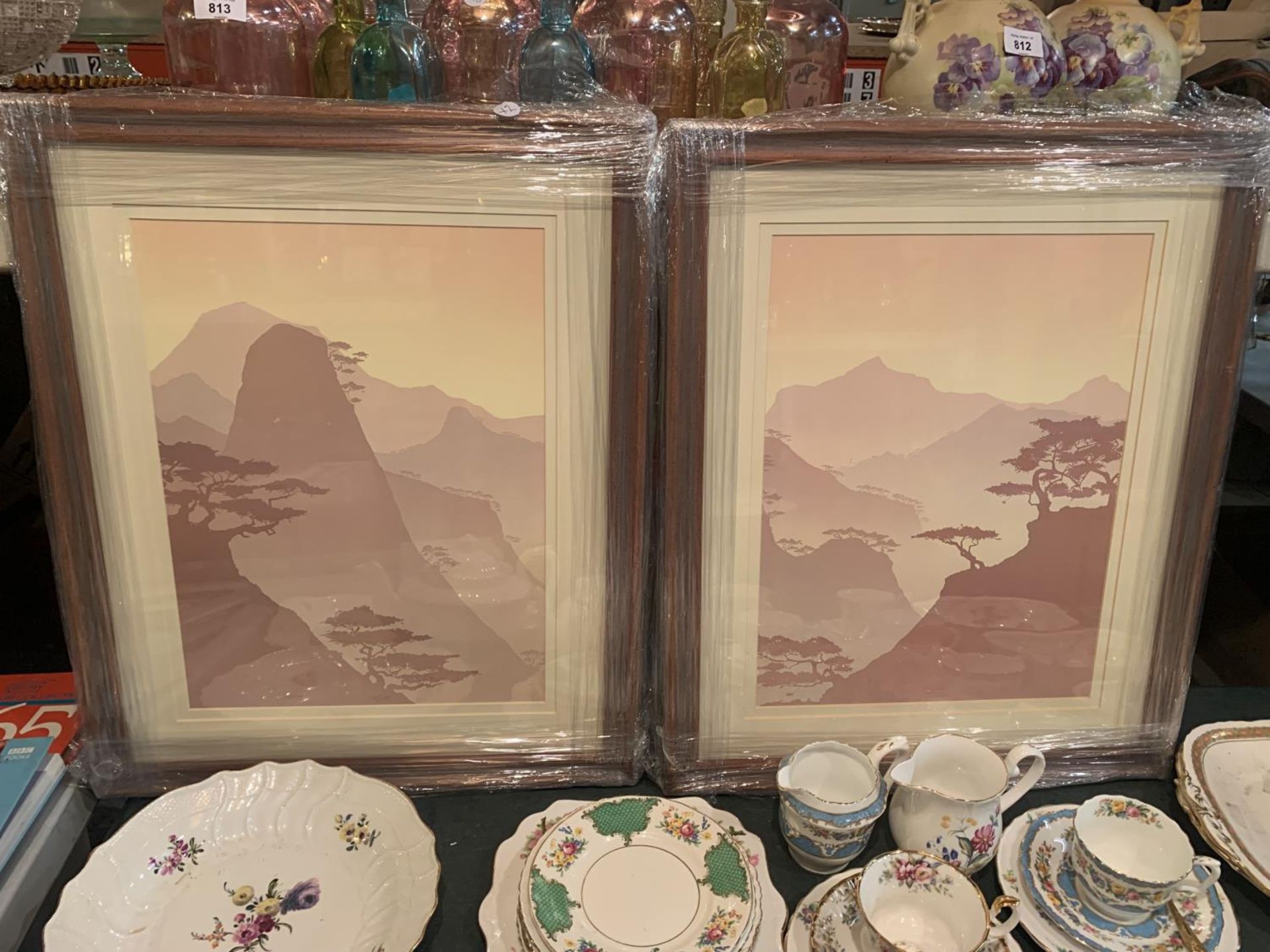 TWO FRAMED PASTEL PRINTS OF MOUNTAIN SCENES