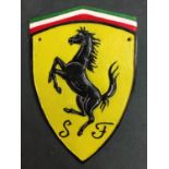 A CAST FERRARI SIGN