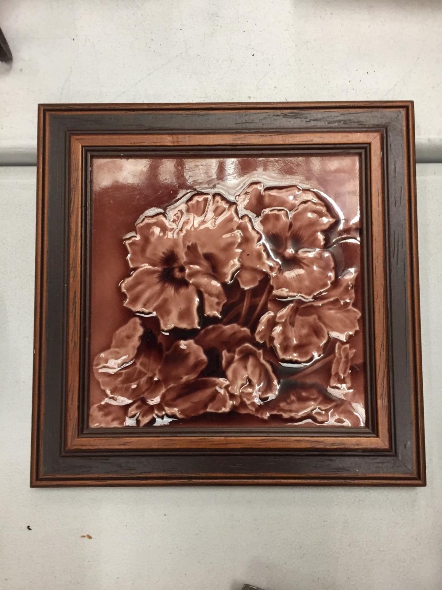 A FRAMED MINTON TILE