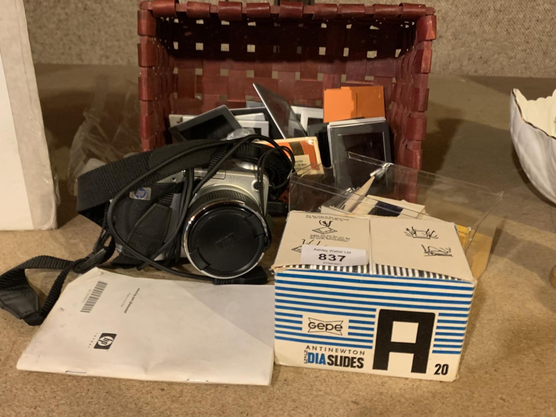 A CAMERA AND COLLECTION OF VARIOUS SLIDES