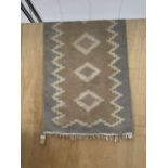 A TRIBAL KALIM FRINGED CARPET RUNNER