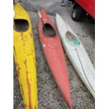 A RED CANOE AND PADDLE