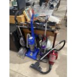 A GROUP OF FOUR VACUUM CLEANERS TO INCLUDE TWO VAX AND A DYSON DC24 ETC