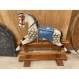 A VINTAGE CHILDRENS WOODEN ROCKING HORSE