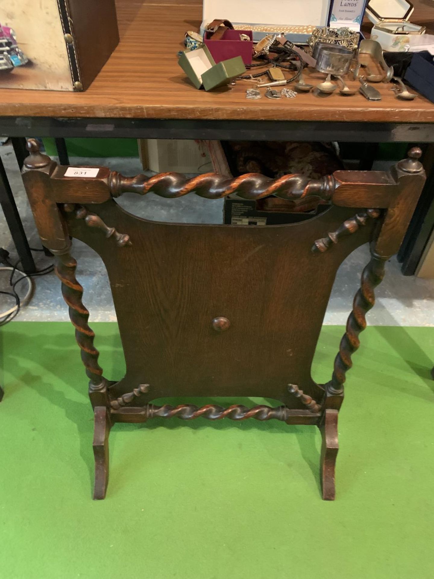 AN OAK FIRESCREEN WITH BARLEY TWIST DETAIL