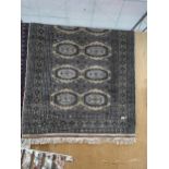 A BROWN PATTERNED RUG