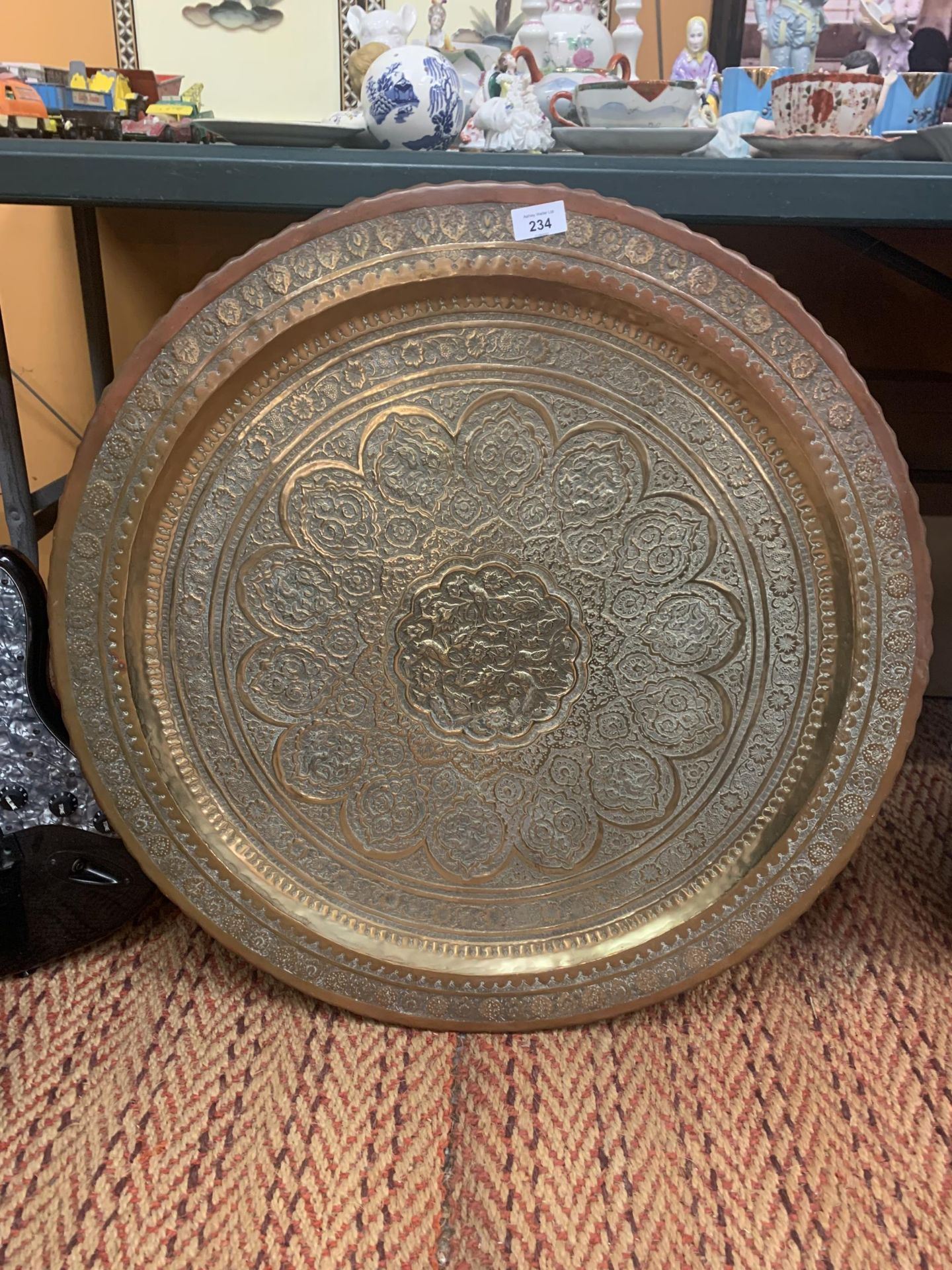 A LARGE ORIENTAL BRASS CHARGER 72CM DIAMETER