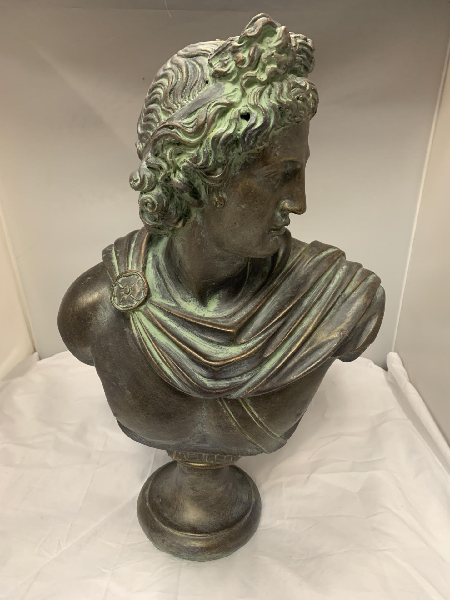 A LARGE BRONZE EFFECT STONE BUST OF APOLLO, HEIGHT APPROX 51CM