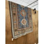 A KAZAX STYLE FRINGED PATTERNED RUG