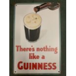 A VINTAGE STYLE METAL GUINNESS BEER SIGN