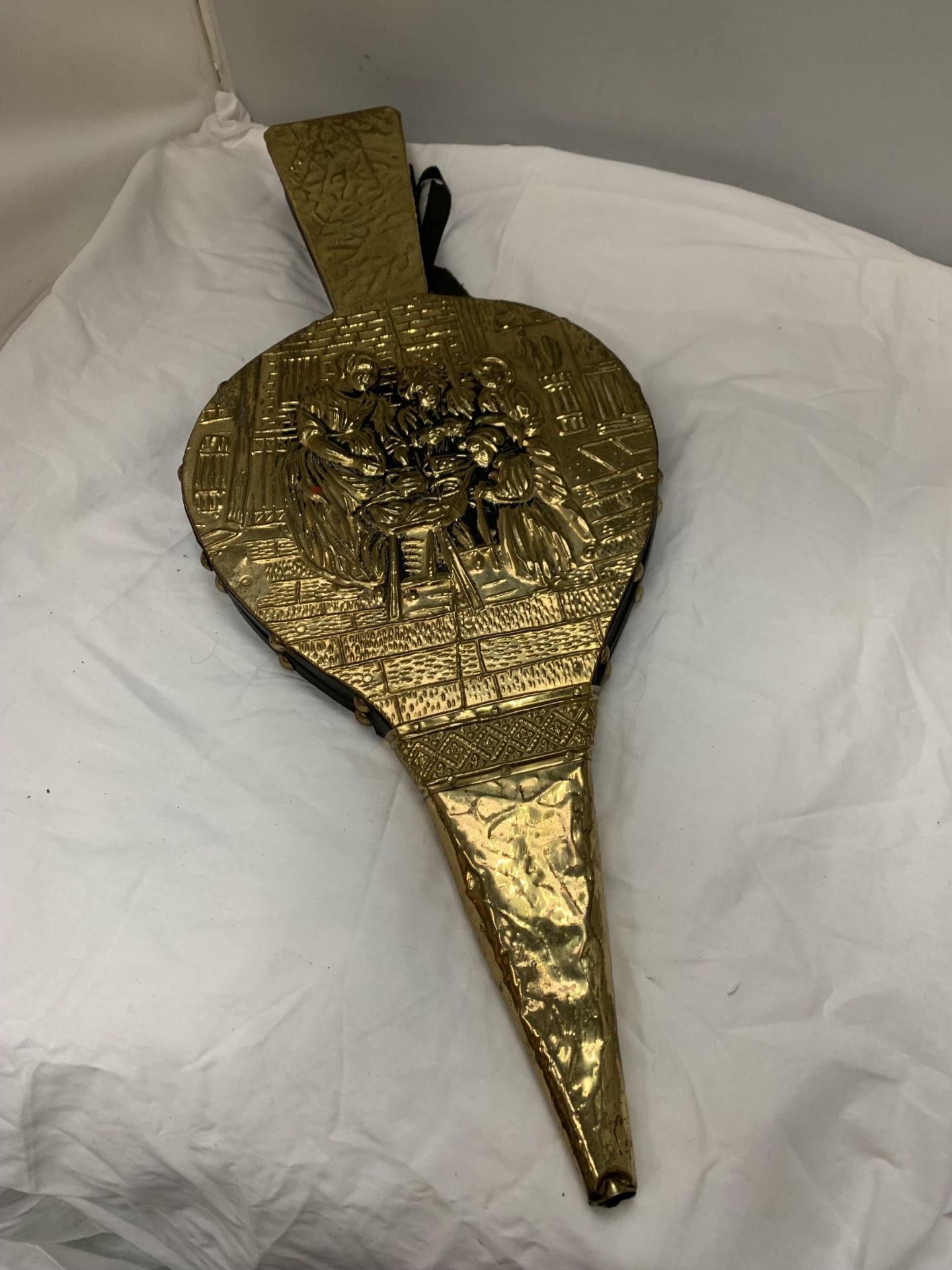 A LARGE PAIR OF WOODEN AND BRASS FIRESIDE BELLOWS DEPICTING A FAMILY SCENE