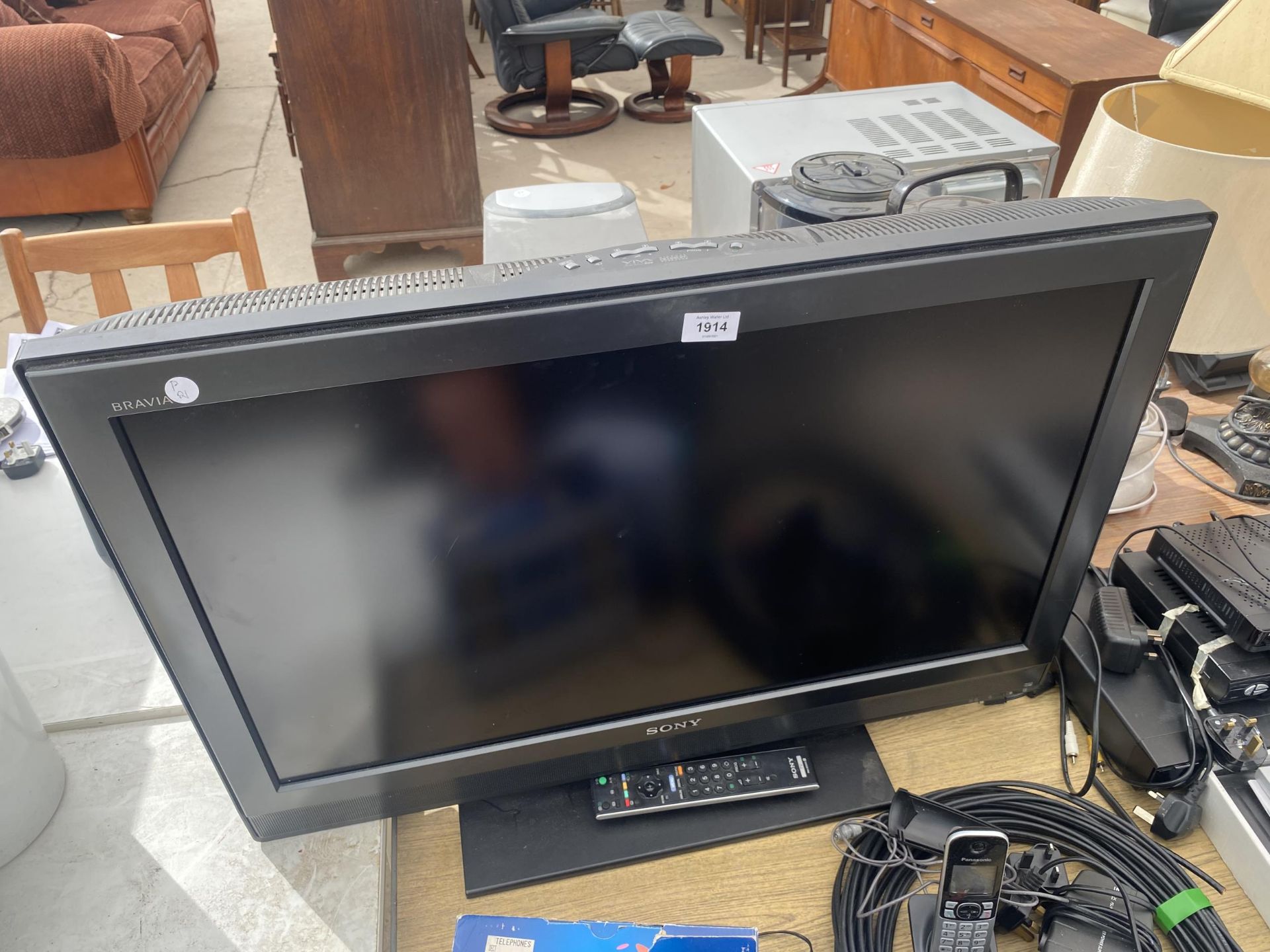 A 32" SONY BRAVIA TELEVISON WITH REMOTE CONTROL