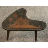 AN UNUSUAL SHAPED GLASS TOPPED OCCASIONAL TABLE WITH CARIBBEAN STYLE DECORATION