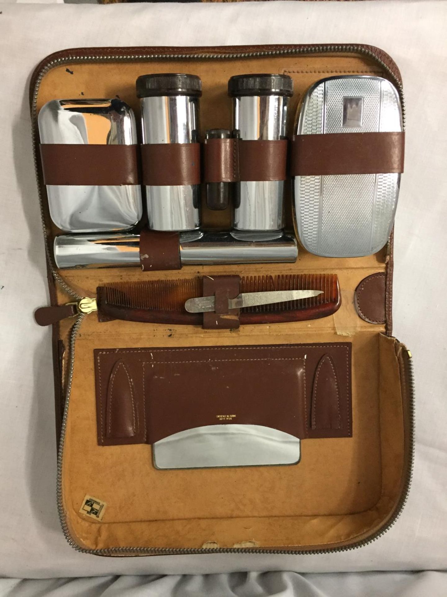 A GENTLEMAN'S GROOMING SET IN LEATHER CASE