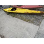 A YELLOW CANOE AND PADDLE